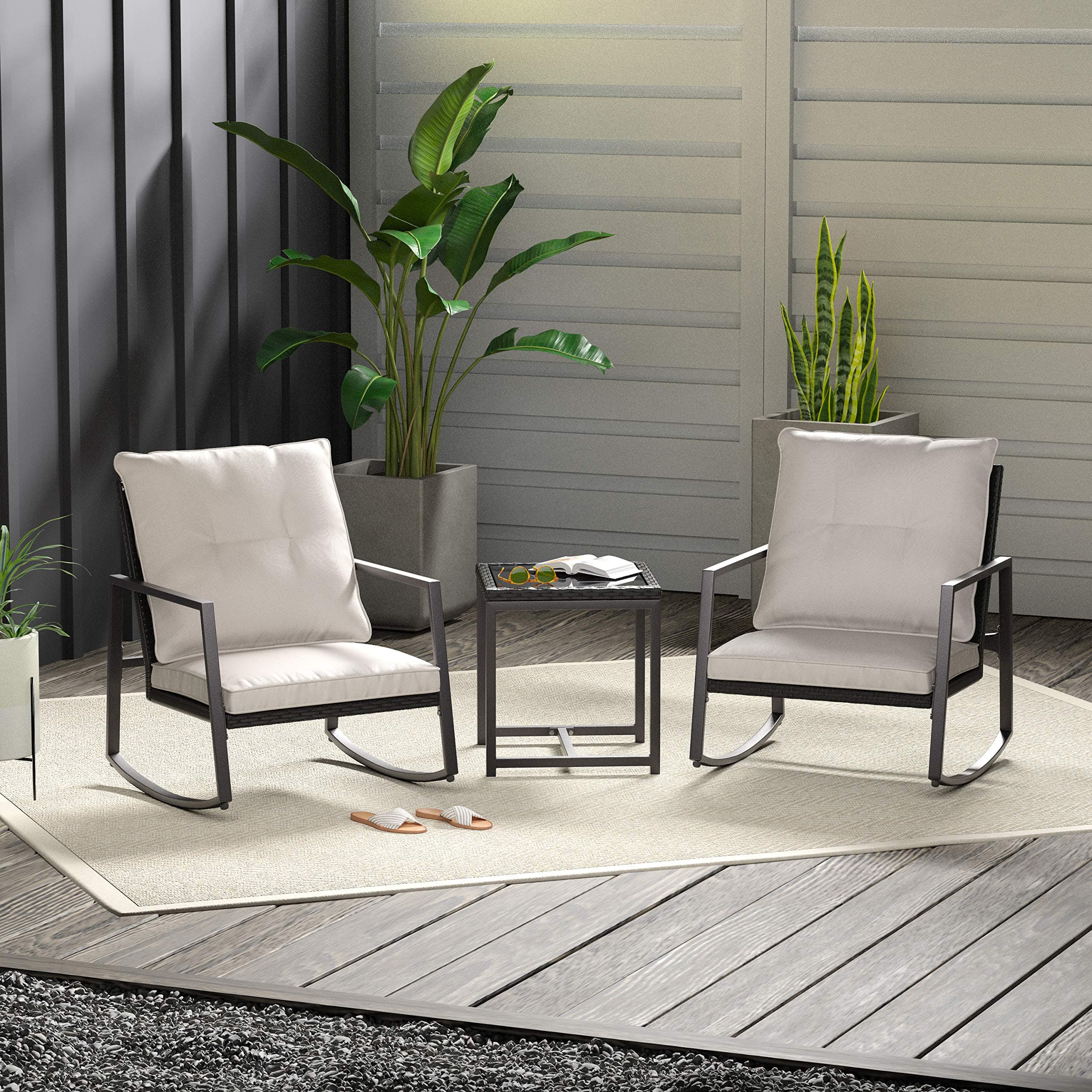 Amazon Basics 3-Piece PE Rattan Wicker Rocking Chair Outdoor Patio Set — complete set on patio; decorative items not included.