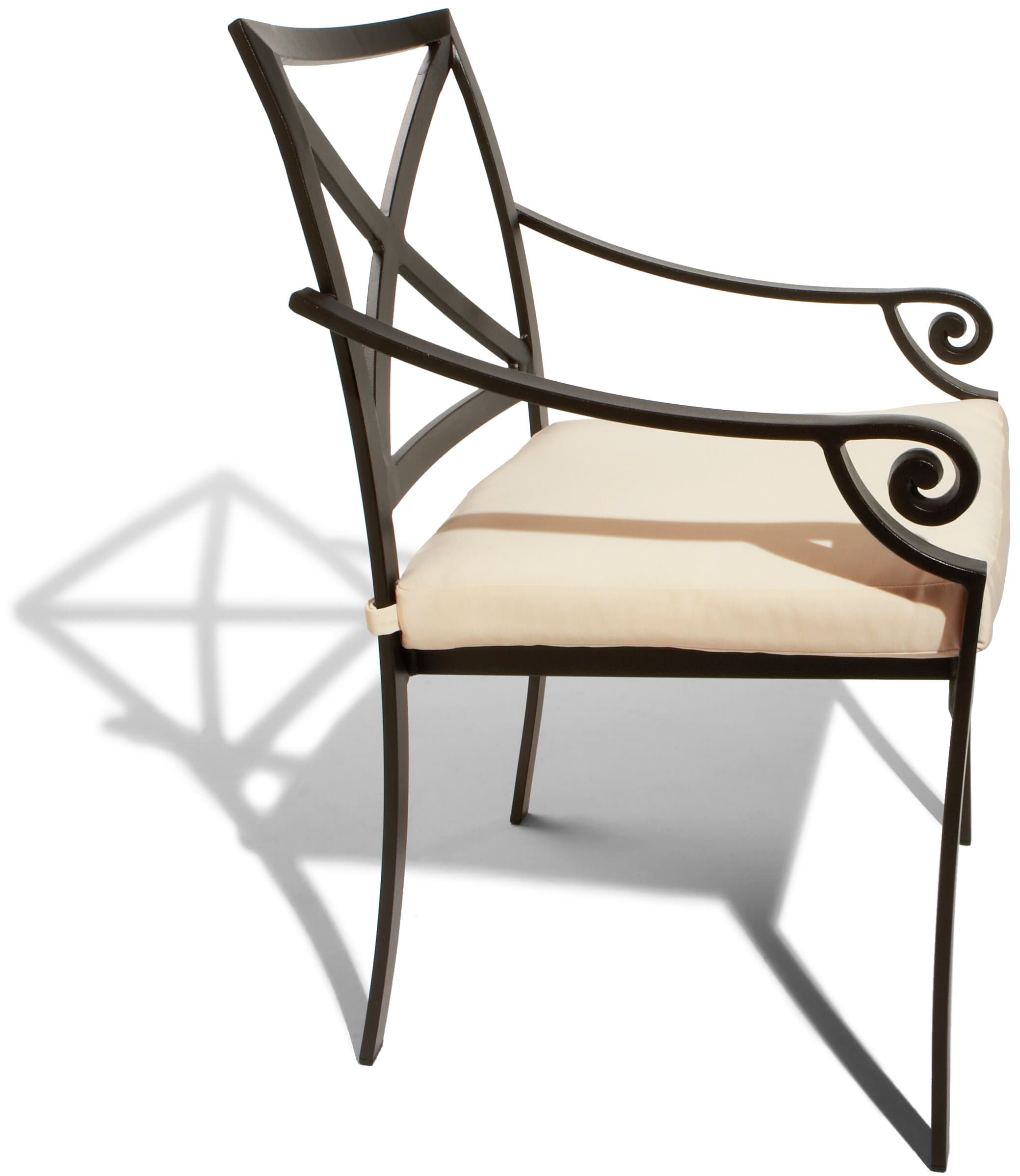 Side view of the Strathwood Falkner dining arm chair, showing its scroll-shaped arm and cushioned seat.