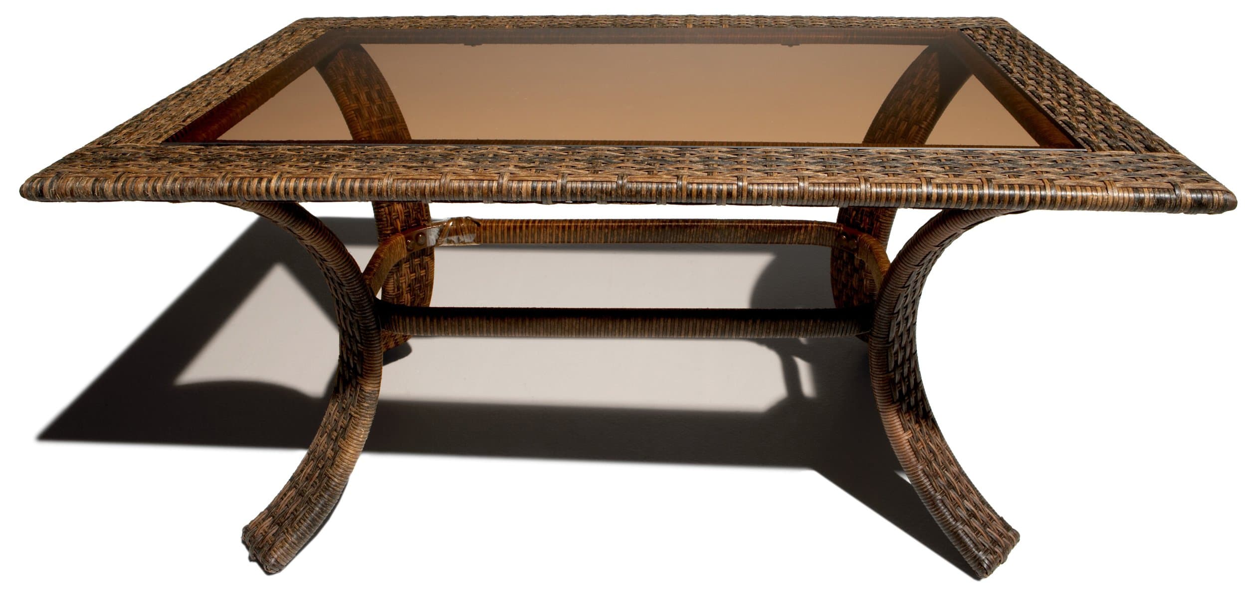 Strathwood rectangular wicker coffee table from the long side, showing its glass top and curved legs.