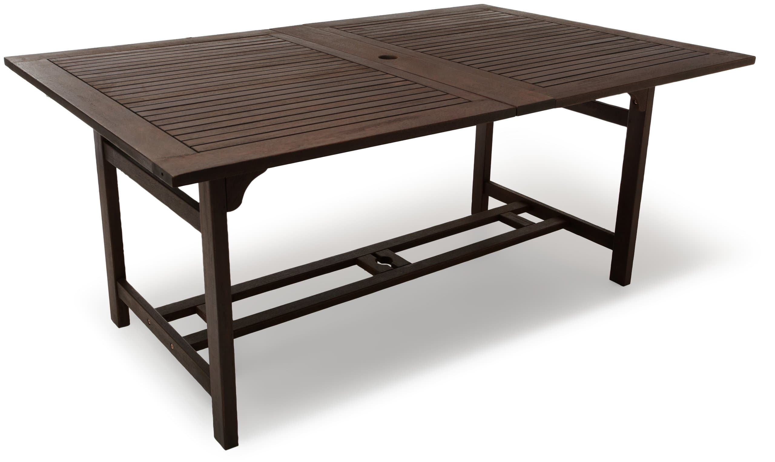Strathwood Blakely wooden dining table in its compact position, shown from a three-quarter angle.