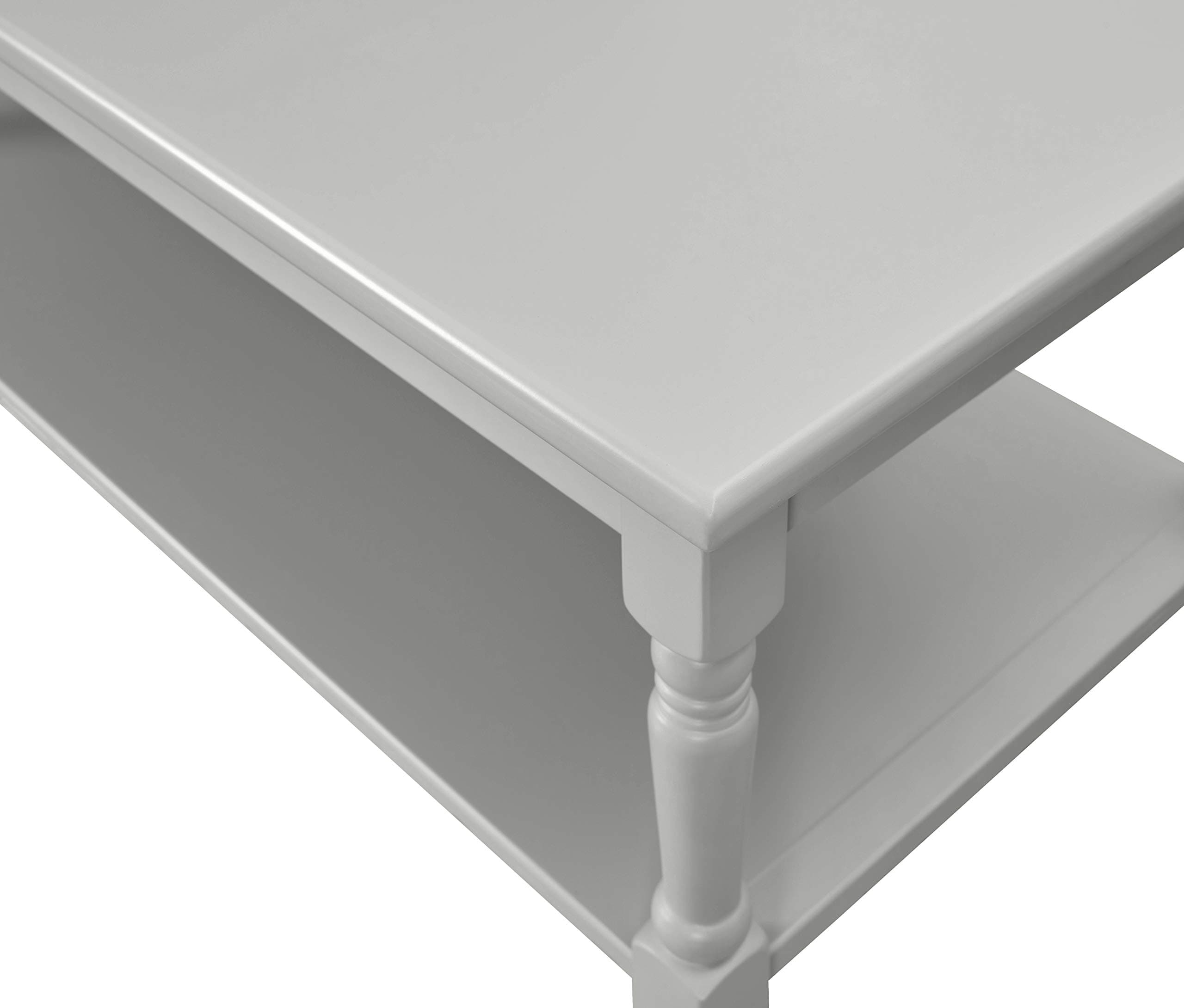 Close overhead view of the Angela table corner, moulded edge and turned leg.