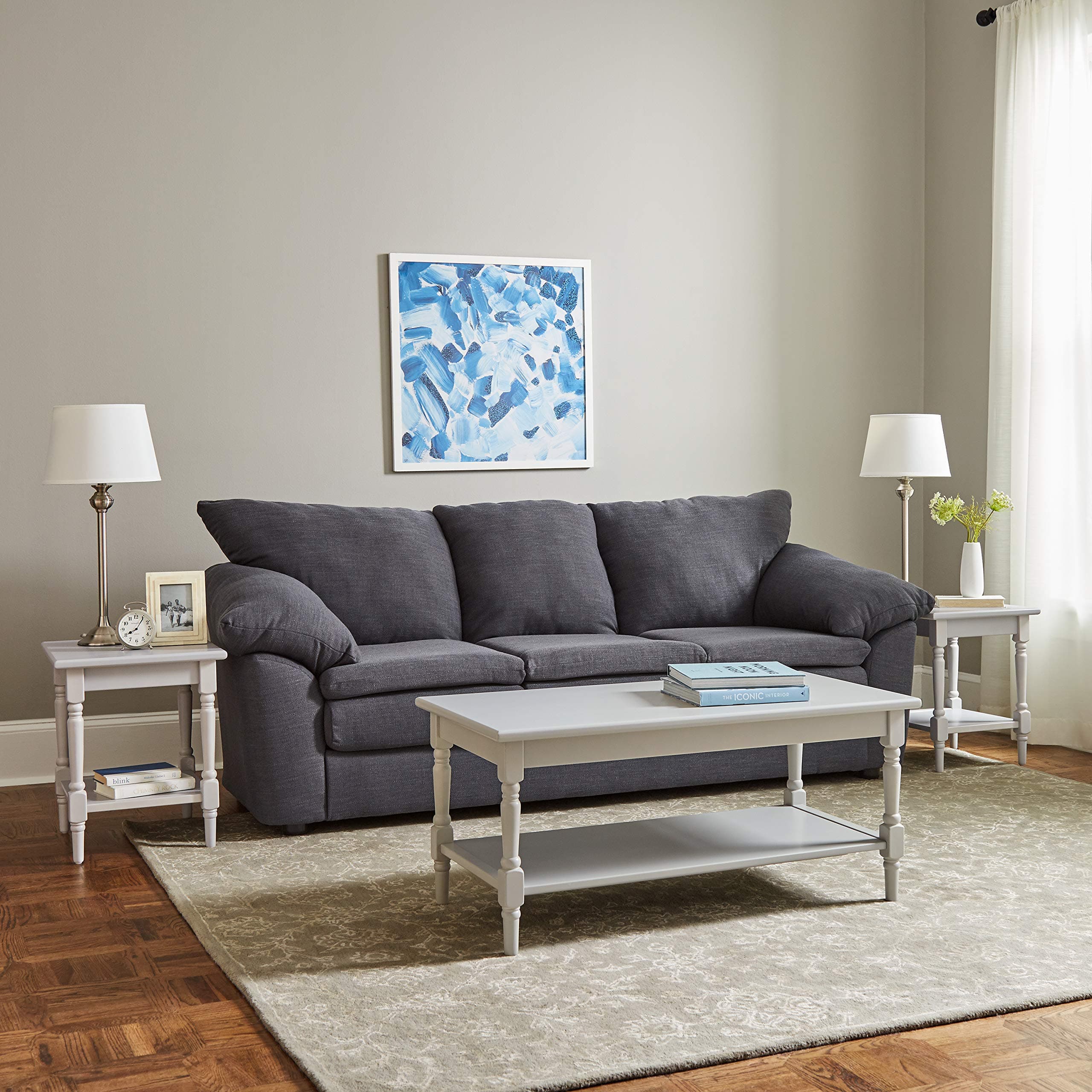 Ravenna Home Angela grey coffee table in front of a sofa in a furnished living room.