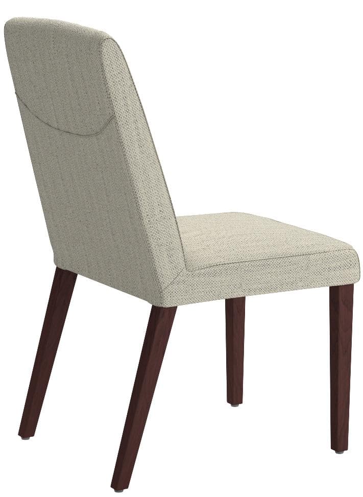One ivory Rivet channel-back dining chair from the set of two, opposite rear three-quarter view.