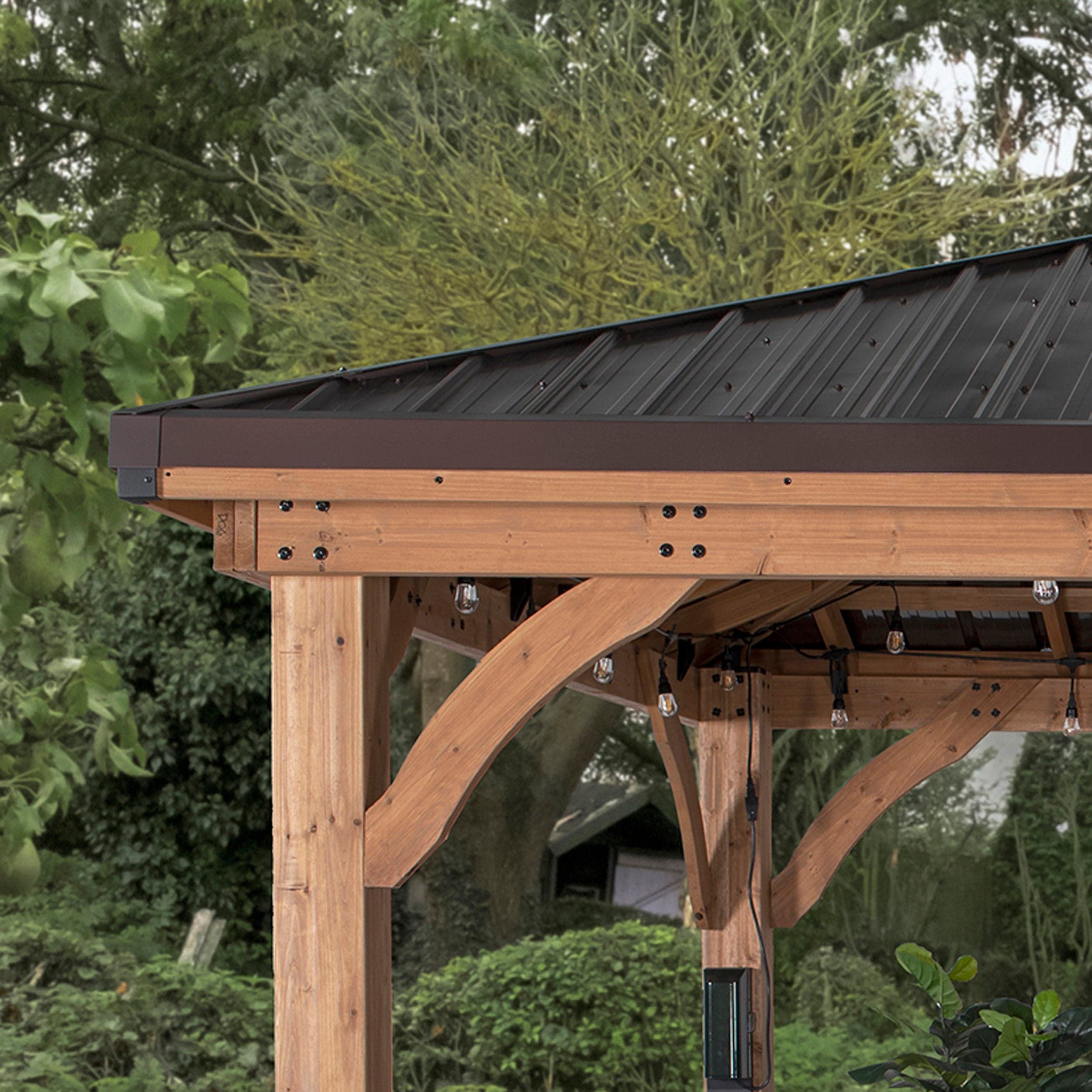 Separate exterior view of the steel roof edge and cedar corner supports