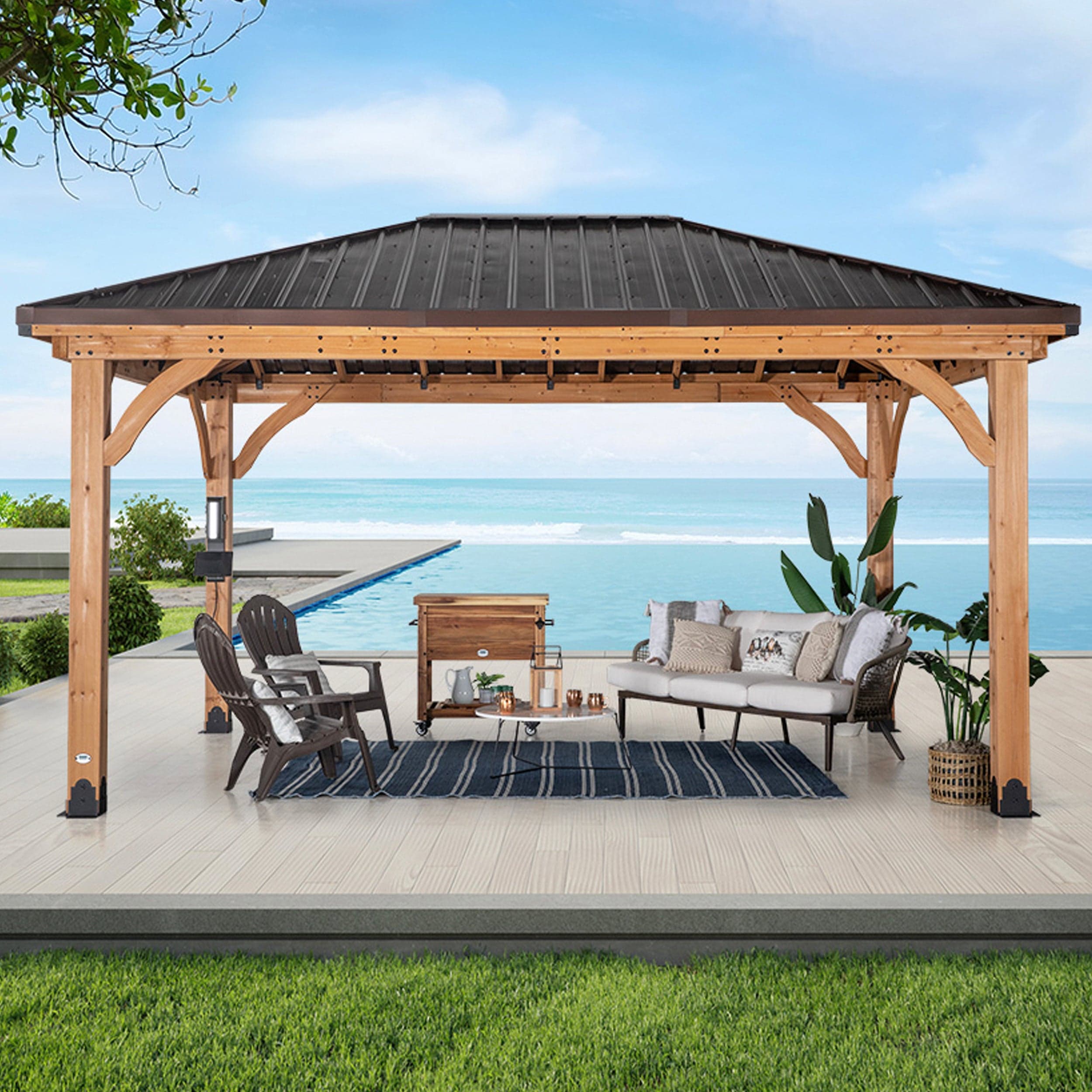 Front view showing the wide gazebo sheltering an outdoor lounge