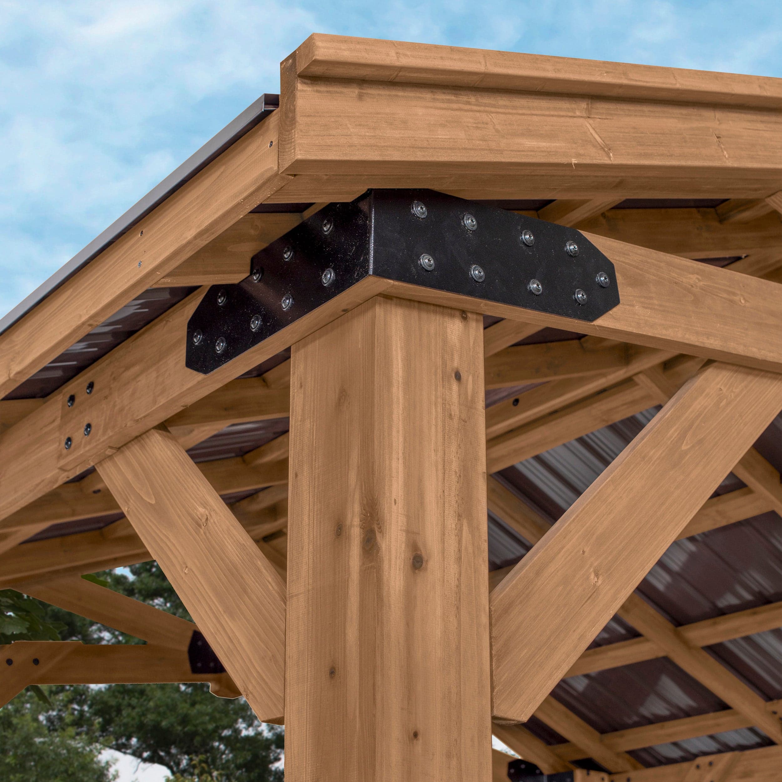 Close view of the cedar corner beam, corbels and black steel brackets