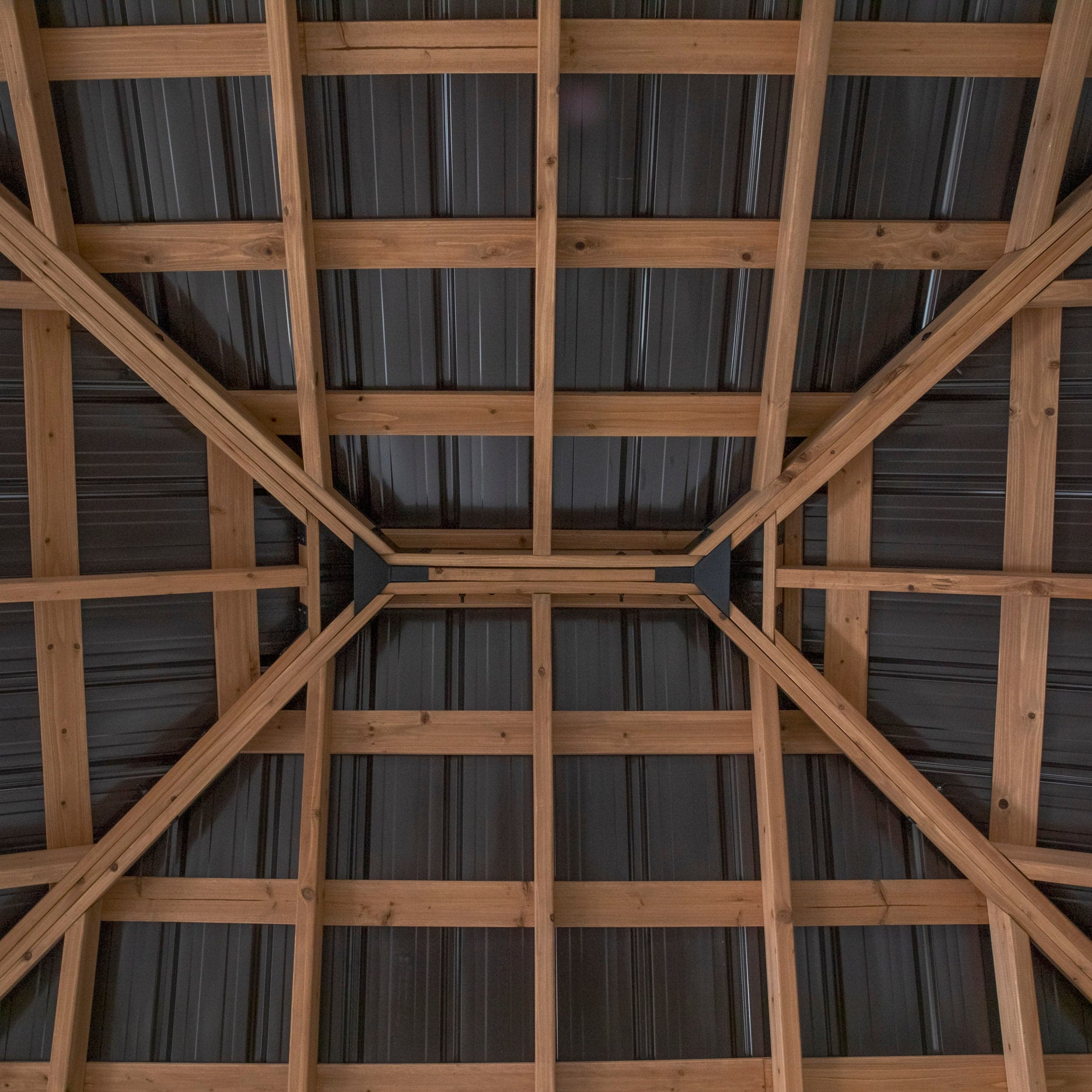 View of the steel roof underside and cedar rafters