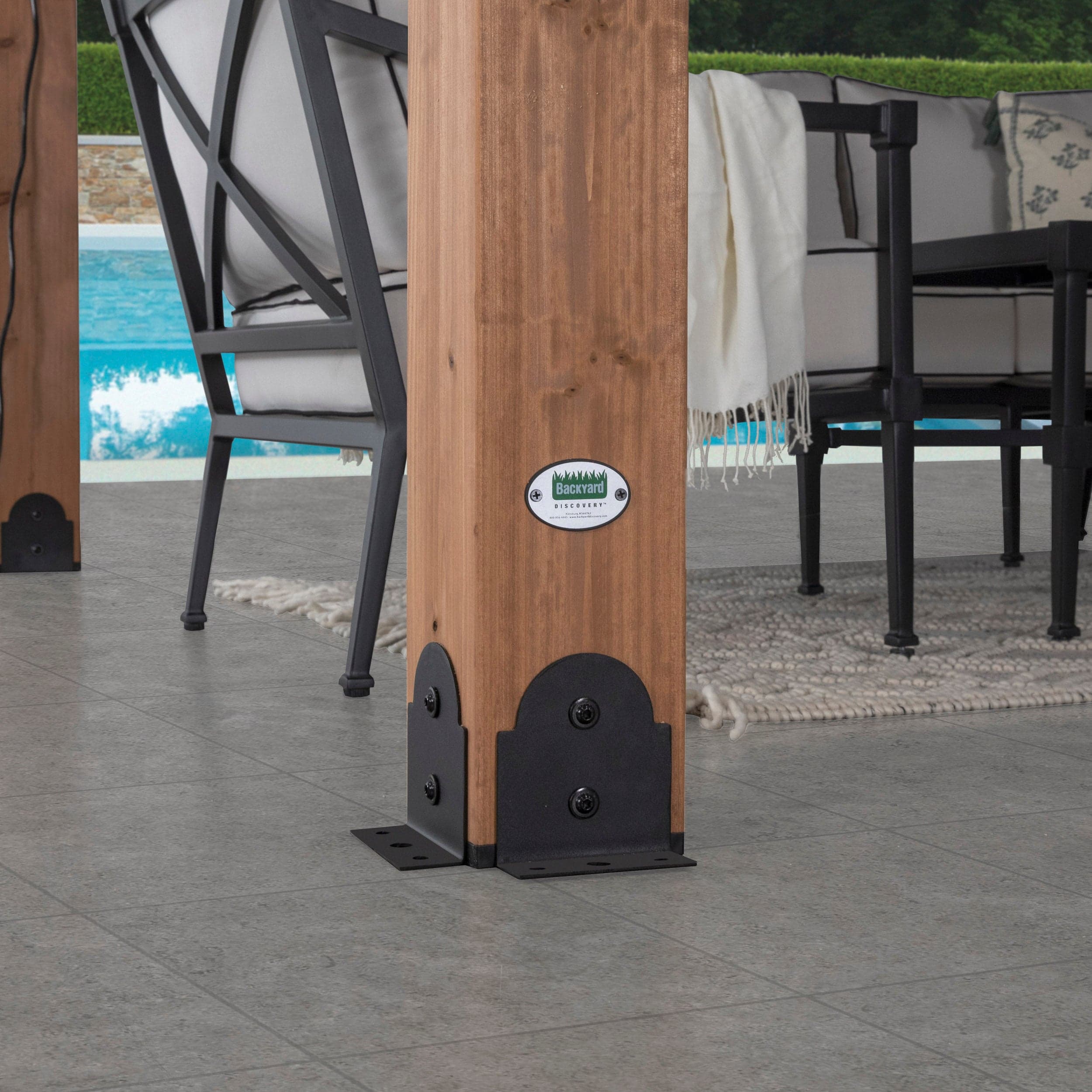Close view of the cedar post base and steel anchoring plate