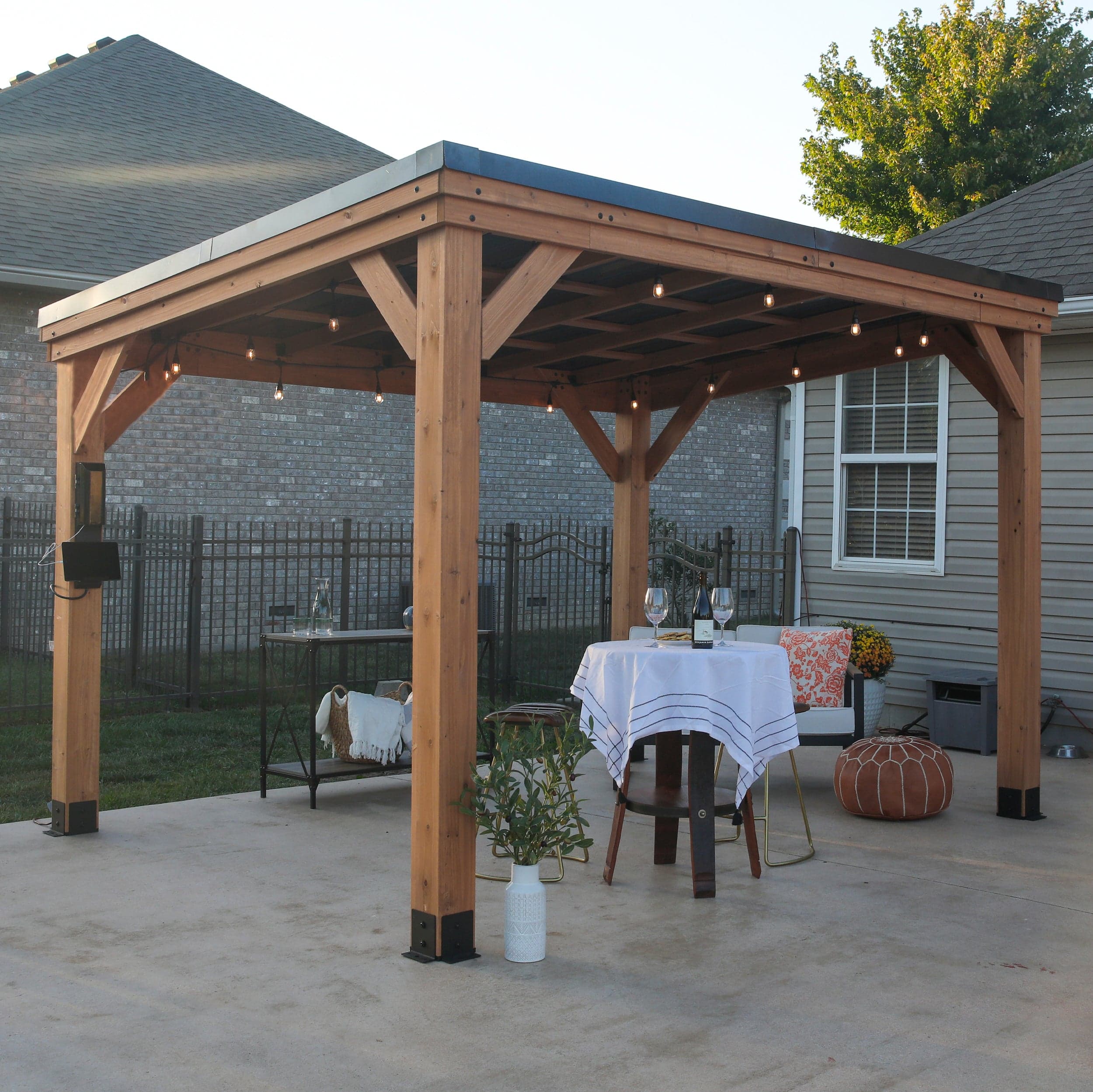 Three-quarter view of the Arcadia sloped roof gazebo on a patio