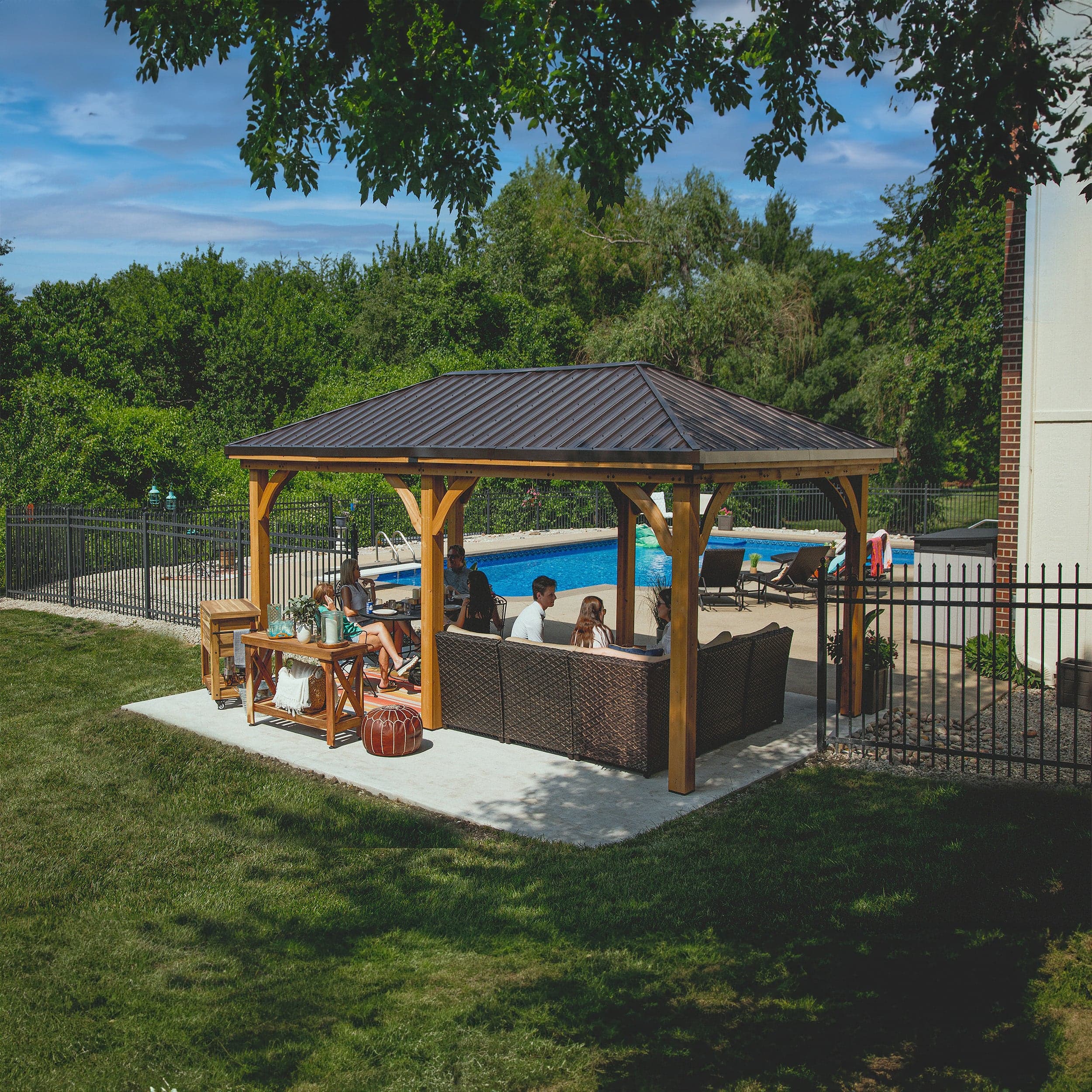 Elevated rear view showing the complete cedar gazebo frame and steel roof