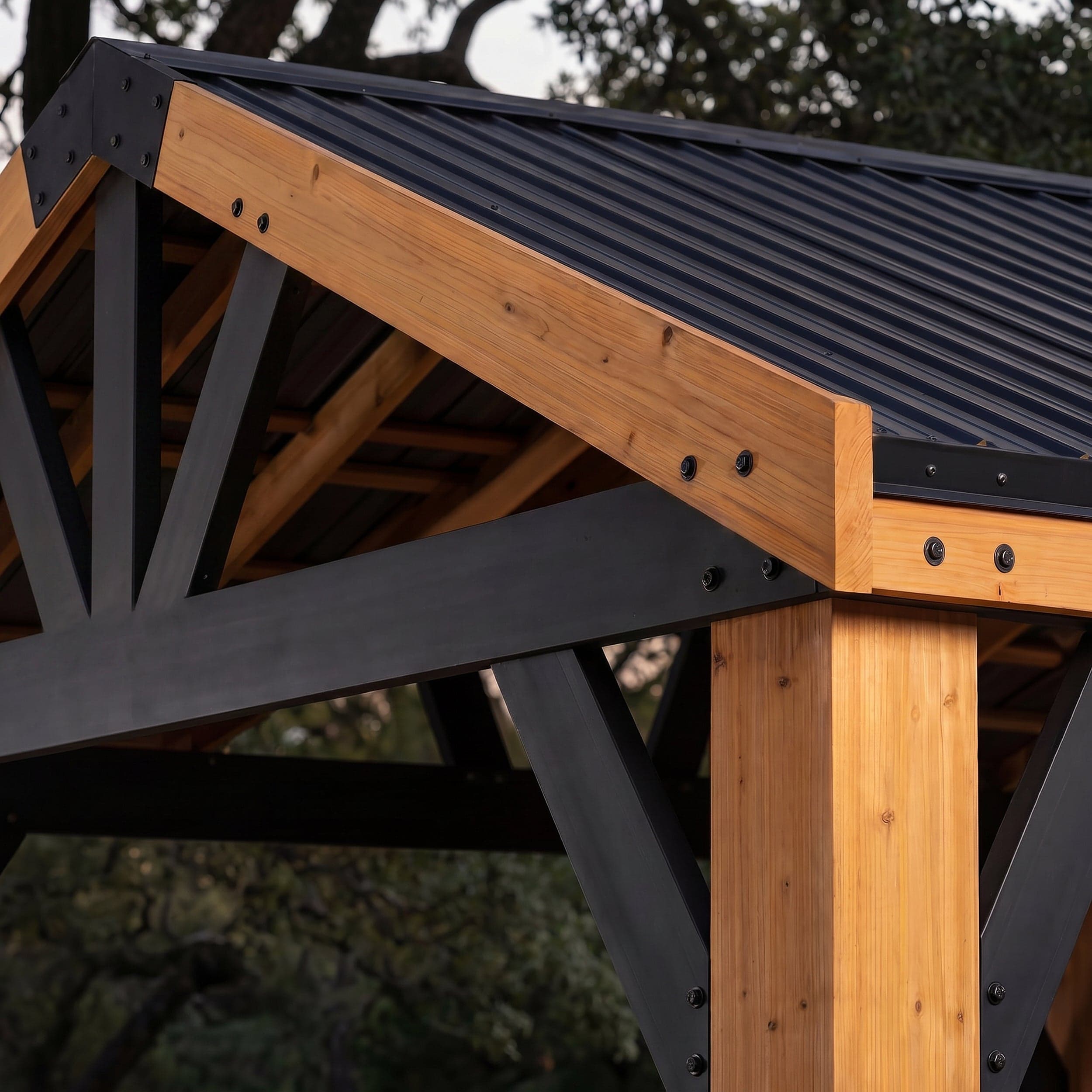 Close view of the black gable trim and cedar corner post