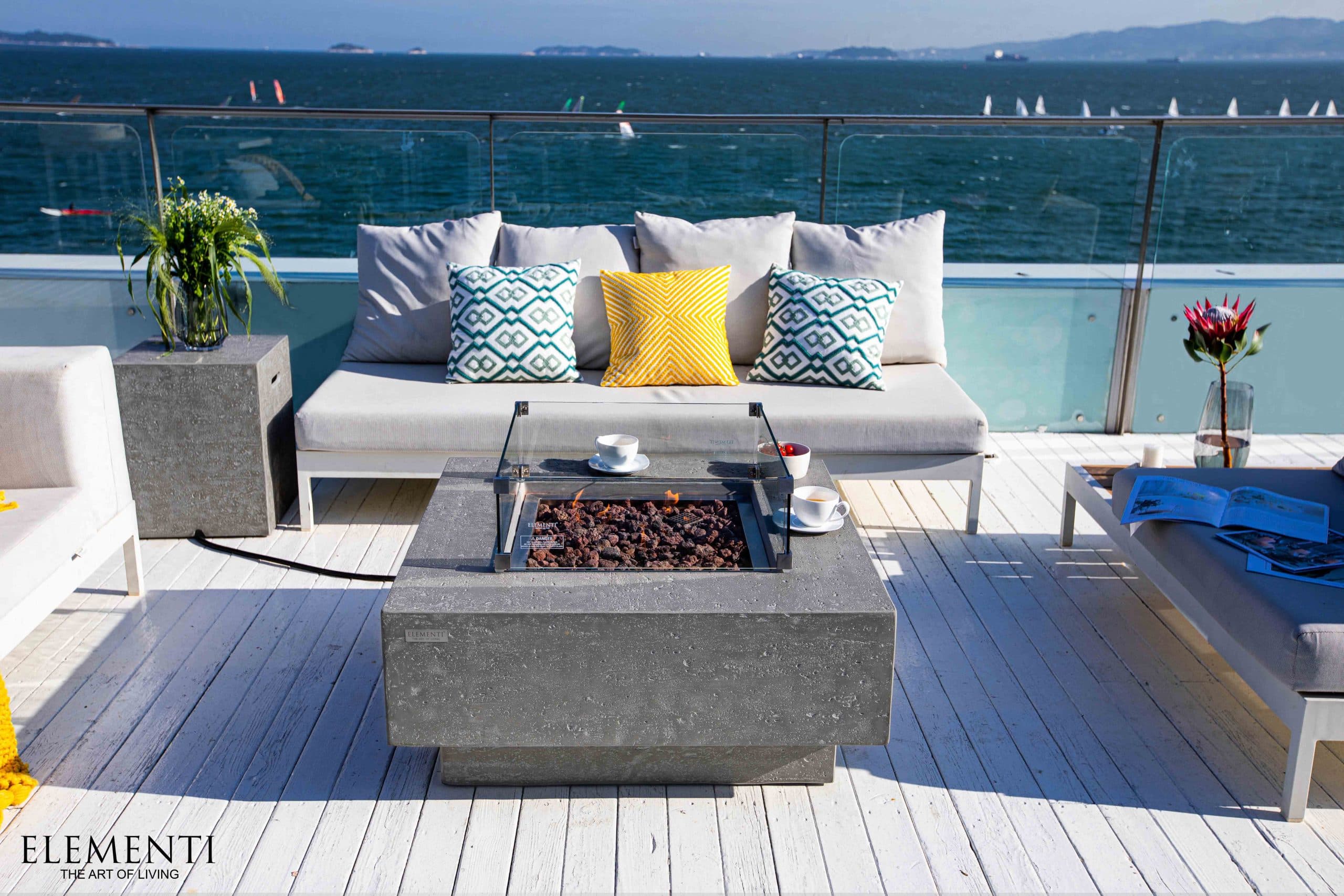 Manhattan fire table beside patio seating