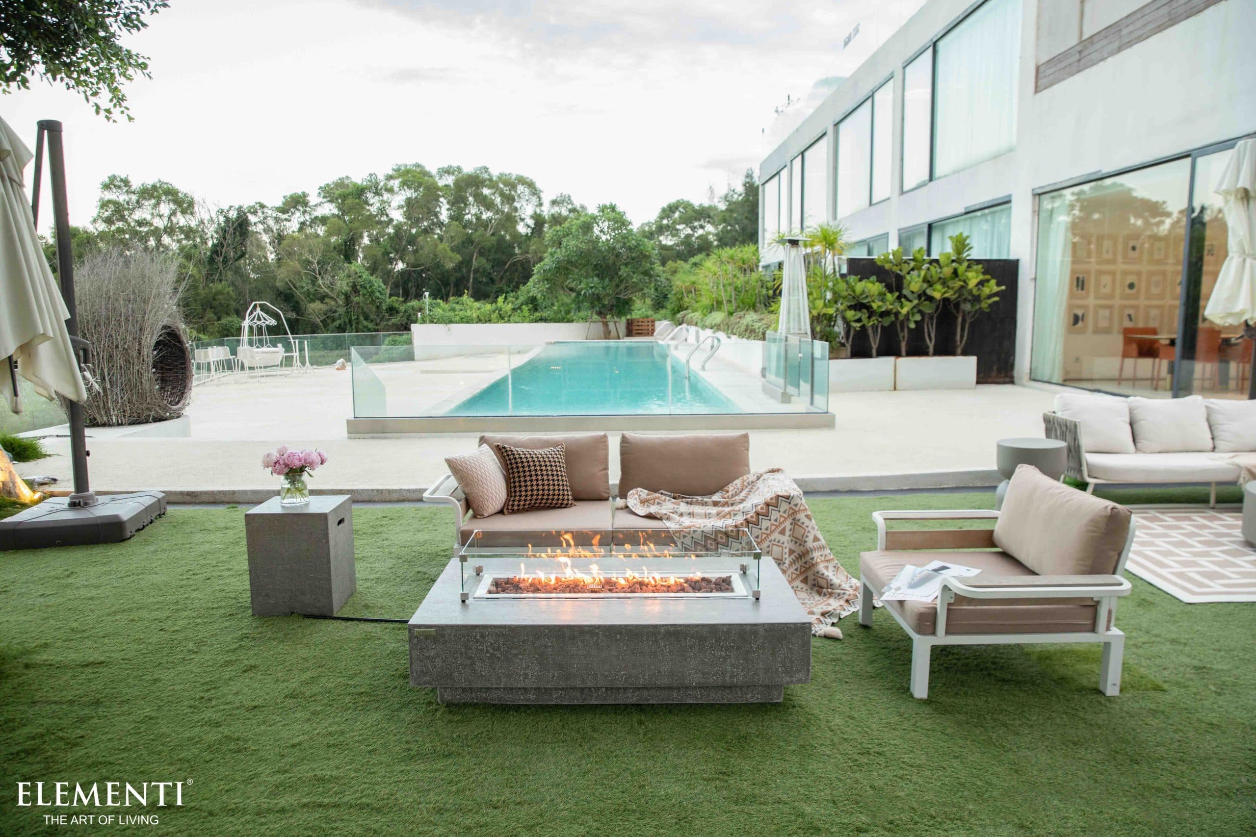 Hampton table beside a swimming pool