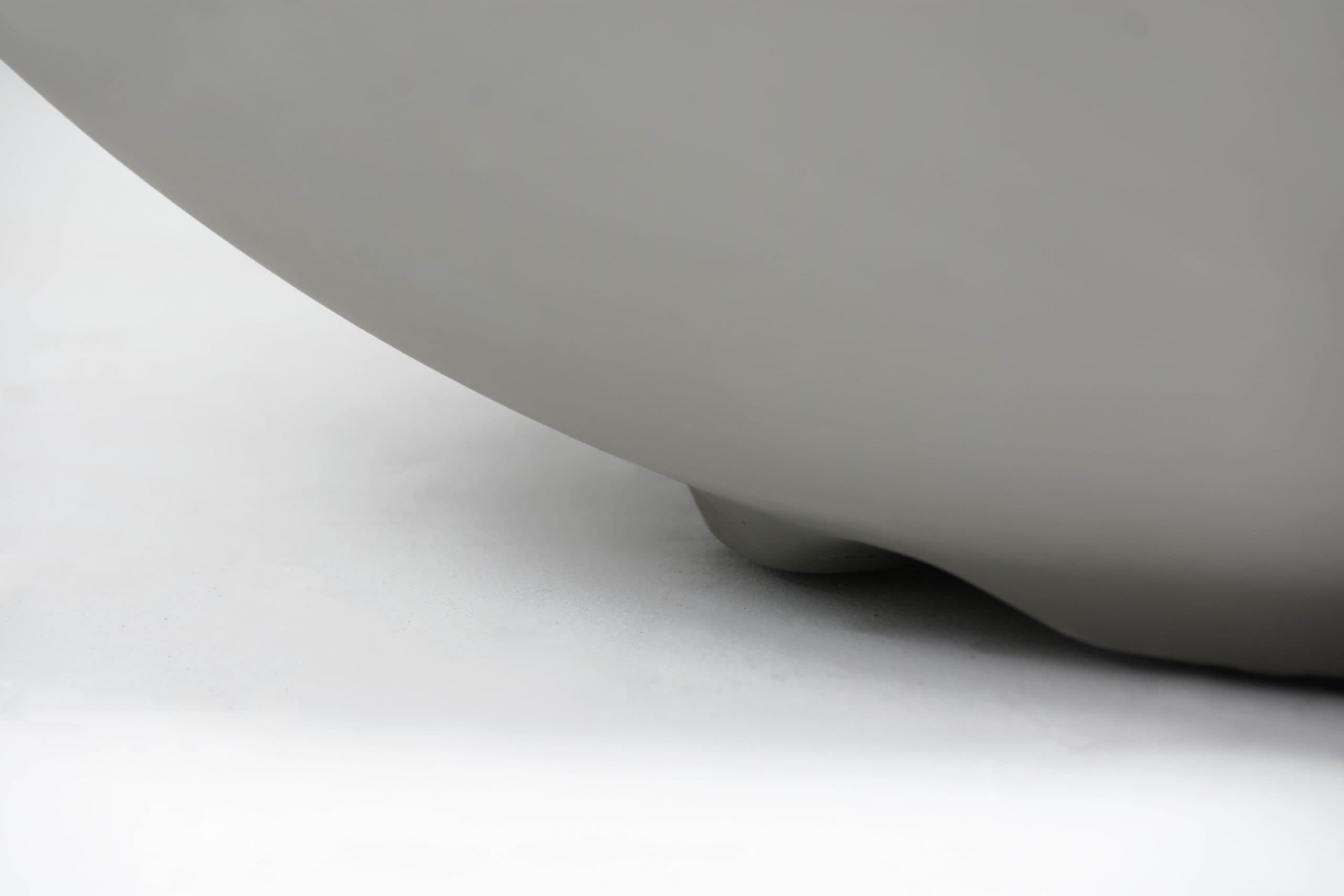 Close view of the curved Roca bowl and base