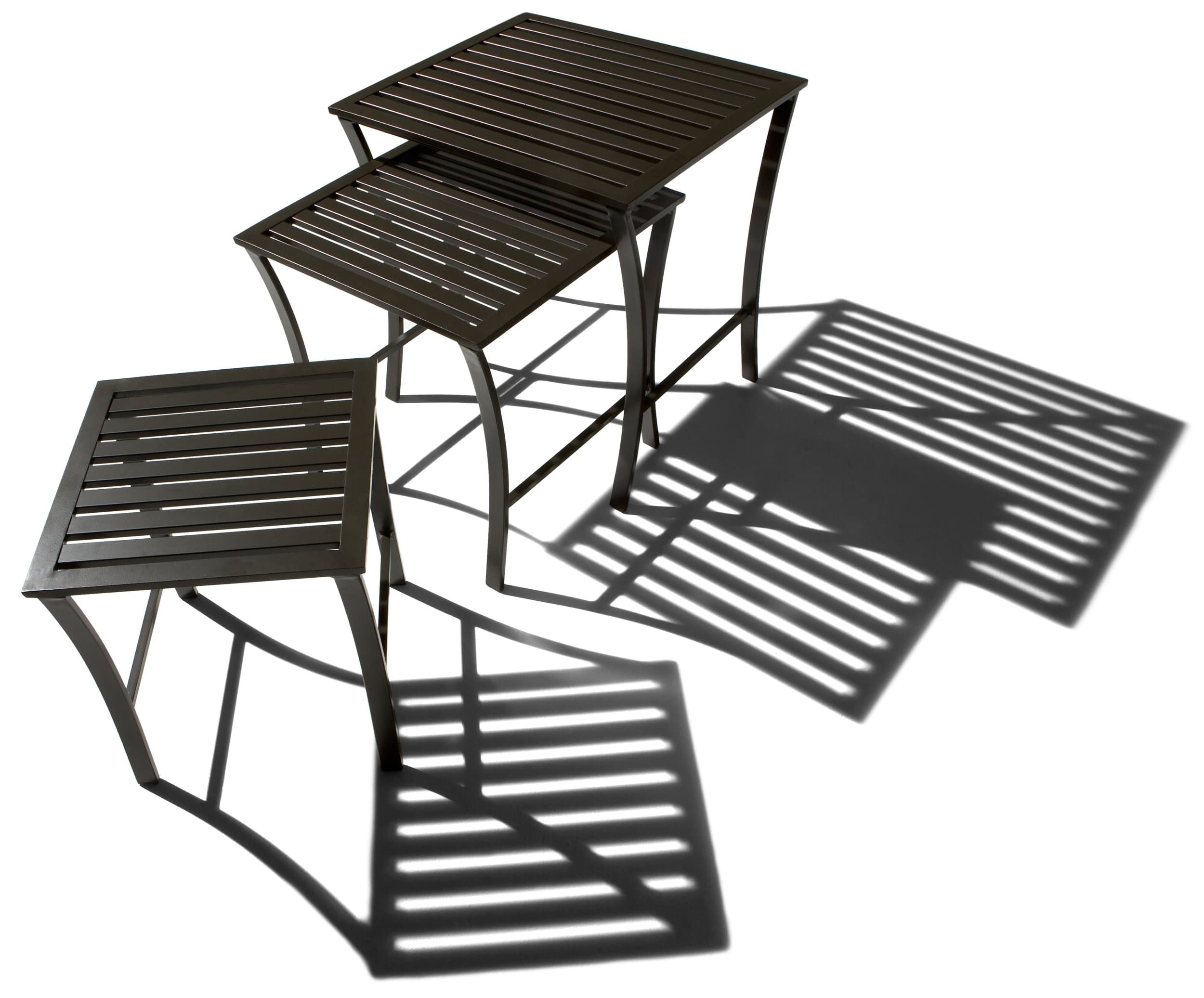 Strathwood nesting tables arranged at different heights from an angled view