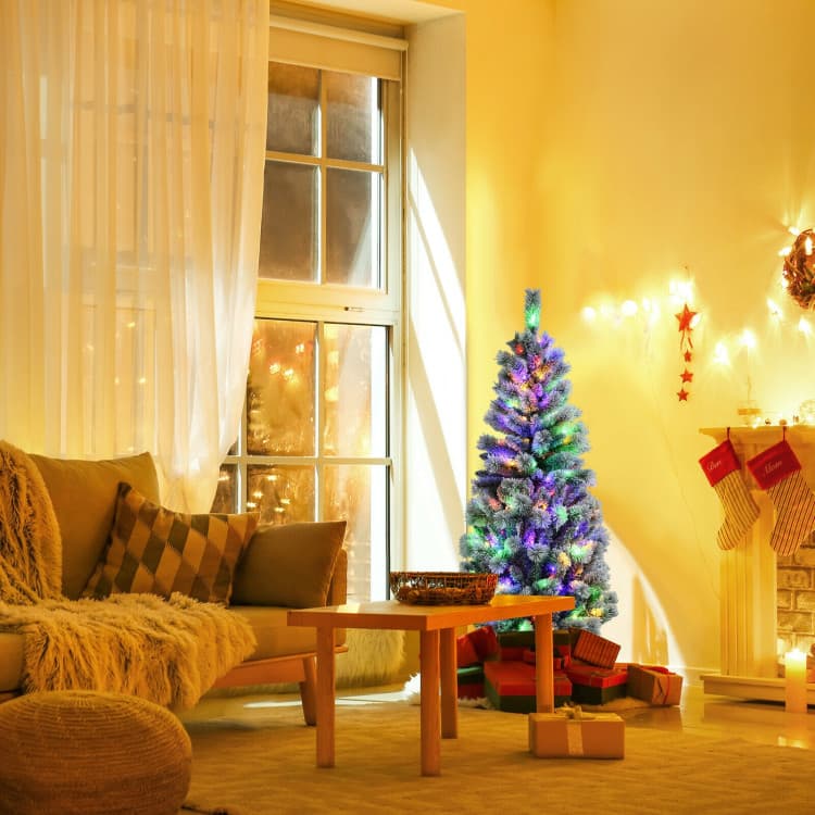5 ft Snow-flocked Tree with Remote-controlled LEDs — room or display setting 6